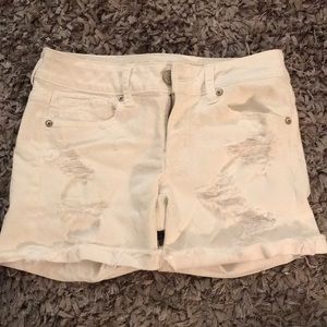 White ripped American Eagle shorts